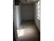 Empty, unfinished basement with concrete floor and single window at 2124 W Main St # C, Albemarle, NC 28001