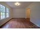 Spacious living room featuring hardwood floors and large windows at 105 Timber Ridge Rd, Belmont, NC 28012