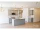 Modern kitchen with gray cabinets and marble island at 3035 Swallowtail Ln # 44, Kannapolis, NC 28083