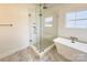 Bathroom featuring a walk-in shower and a soaking tub at 3035 Swallowtail Ln # 44, Kannapolis, NC 28083