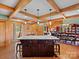 Open kitchen with granite island, hardwood floors, and exposed wooden beams at 10510 Hartsell Rd, Midland, NC 28107