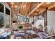 Bright dining room with glass table and unique metal chairs, located under a lofted ceiling at 19010 Kailua Cir, Tega Cay, SC 29708