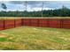 Backyard with wooden privacy fence at 602 Lamorak Pl, Richburg, SC 29729