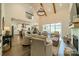 Open floor plan living room with high ceilings, kitchen, and fireplace at 540 Kenway Loop, Mooresville, NC 28117
