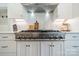 Stainless steel range and white cabinets in this open concept kitchen at 540 Kenway Loop, Mooresville, NC 28117