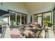 Relaxing screened porch with firepit and seating at 540 Kenway Loop, Mooresville, NC 28117
