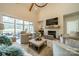 Spacious living room with high ceilings, fireplace, and access to backyard at 540 Kenway Loop, Mooresville, NC 28117