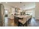 Modern kitchen with white cabinets, large island, and stainless steel appliances at 540 Kenway Loop, Mooresville, NC 28117