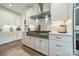 Bright kitchen with white cabinets, stainless steel range and a pot filler at 540 Kenway Loop, Mooresville, NC 28117