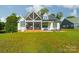 Exterior of house with large backyard and screened porch at 540 Kenway Loop, Mooresville, NC 28117