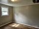 Simple bedroom with light walls and wood-look flooring at 145 33Rd Sw St, Hickory, NC 28602