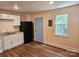 Bright kitchen features white cabinets, new flooring and appliances at 145 33Rd Sw St, Hickory, NC 28602