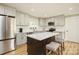 Modern kitchen with light cabinets, quartz countertops, and stainless steel appliances at 1001 E 22Nd St, Kannapolis, NC 28083