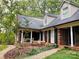 Brick house exterior with a covered front porch at 701 Whippoorwill Ln, Concord, NC 28025