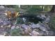 Serene backyard pond with stone border and decorative accents at 701 Whippoorwill Ln, Concord, NC 28025