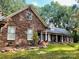 Brick house exterior with a large front yard at 701 Whippoorwill Ln, Concord, NC 28025