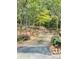 Long driveway leading up to house through woods at 701 Whippoorwill Ln, Concord, NC 28025