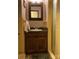 Small bathroom with single vanity, shower, and mirror at 701 Whippoorwill Ln, Concord, NC 28025