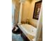 Elegant bathroom with large soaking tub and columns at 701 Whippoorwill Ln, Concord, NC 28025