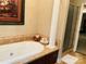 Luxurious bathroom featuring a soaking tub and shower at 701 Whippoorwill Ln, Concord, NC 28025