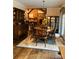 Bright dining room with hardwood floors and period furniture at 701 Whippoorwill Ln, Concord, NC 28025