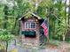 Charming wooden -shed with American flag at 701 Whippoorwill Ln, Concord, NC 28025