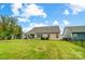 Large backyard with green grass and a partially visible house at 731 Wood Lily Dr, Belmont, NC 28012