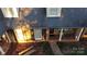 Charming front porch with brick columns and rocking chair on a fall afternoon at 701 Whippoorwill Ln, Concord, NC 28025