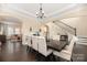 Elegant dining room featuring a large table and comfortable seating for eight at 16827 Monocacy Blvd, Huntersville, NC 28078