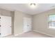 Simple bedroom with double-door closet and a window at 220 E Warfield Dr, Mooresville, NC 28115