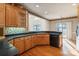 Kitchen features ample wood cabinets and a breakfast nook at 108 Cottonwood Dr, Mount Holly, NC 28120