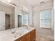 Bathroom boasts a double vanity, shower, and a separate tub at 108 Cottonwood Dr, Mount Holly, NC 28120