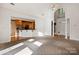 Spacious living room with high ceilings, fireplace, and kitchen view at 108 Cottonwood Dr, Mount Holly, NC 28120