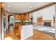 Kitchen features wood cabinets, breakfast bar, and views to Gathering room at 108 Cottonwood Dr, Mount Holly, NC 28120