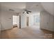 Spacious bedroom with carpet flooring, ceiling fan, and access to bathroom at 108 Cottonwood Dr, Mount Holly, NC 28120