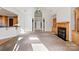 Living room with high ceilings, fireplace, and built-in shelving at 108 Cottonwood Dr, Mount Holly, NC 28120