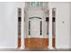 Grand entryway with hardwood floors and columns at 108 Cottonwood Dr, Mount Holly, NC 28120