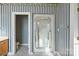 Bathroom with shower, toilet and wood cabinets at 108 Cottonwood Dr, Mount Holly, NC 28120