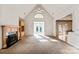 Spacious living room with fireplace and sunroom access at 108 Cottonwood Dr, Mount Holly, NC 28120