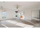 Bright bedroom with large windows and ceiling fan at 108 Cottonwood Dr, Mount Holly, NC 28120