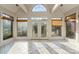 Sunroom with tile floors, multiple windows and access to deck at 108 Cottonwood Dr, Mount Holly, NC 28120