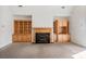Living room with built-in shelving and fireplace at 108 Cottonwood Dr, Mount Holly, NC 28120