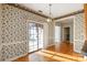 Bright dining area with hardwood floors and access to patio at 108 Cottonwood Dr, Mount Holly, NC 28120