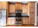 Kitchen with stainless steel appliances and wood cabinets at 108 Cottonwood Dr, Mount Holly, NC 28120