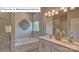 Elegant bathroom with double vanity, soaking tub, and walk-in shower at 504 Zermatt Ct, Monroe, NC 28112