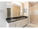 Double vanity bathroom with granite countertop at 10443 Brawley Ln, Charlotte, NC 28215