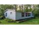 Single wide mobile home with red shutters and a yard at 9226 Maggie Robinson Rd # 143, Waxhaw, NC 28173