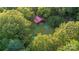 Aerial view showing a house, detached shed, and above ground pool surrounded by lush trees at 9226 Maggie Robinson Rd # 143, Waxhaw, NC 28173