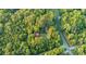 Aerial view of property showing house, shed, and above-ground pool nestled in a wooded area at 9226 Maggie Robinson Rd # 143, Waxhaw, NC 28173