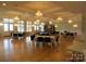 Elegant community room with hardwood floors, chandeliers, and ample seating at 12813 Mayes Rd, Huntersville, NC 28078